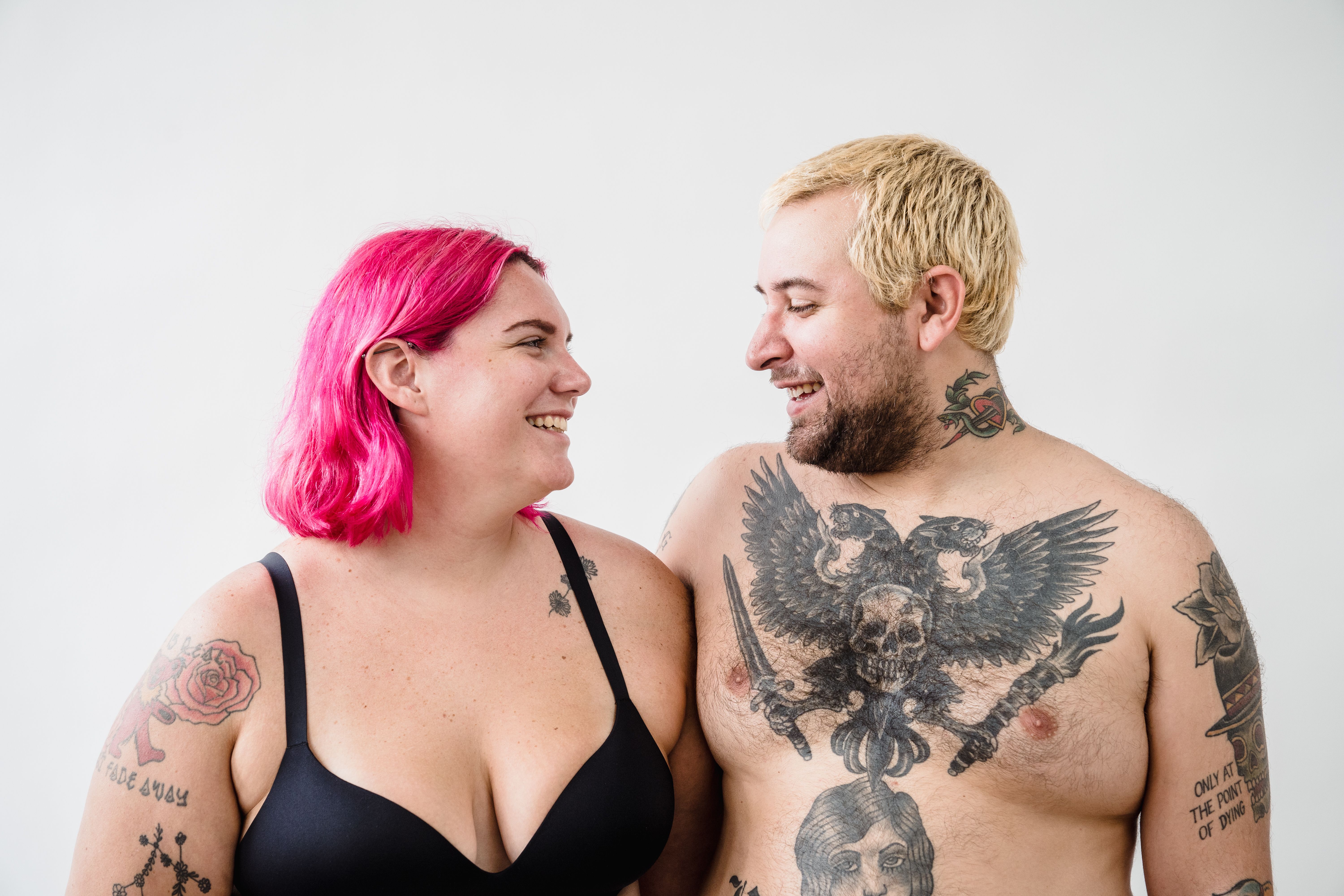 Two smiling people looking at each other